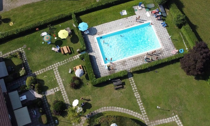 Molina di Ledro Apartamento | Apartamento 'Di Pastei 13' con vistas al lago, piscina compartida y Wi-Fi