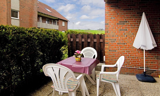 Norddeich Apartamento | Apartamento 'Ferienwohnung 47 Haus Seestern' con terraza privada y Wi-Fi