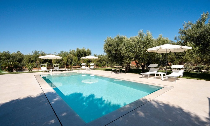 L'Assunta Apartamento | Apartamento 'L'Aia - 1' con piscina compartida, Wi-Fi y aire acondicionado