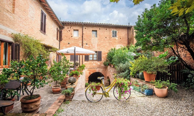 lsola d'Arbia Apartamento | Apartamento 'Loft Antico Mulino' con jardín privado, Wi-Fi y aire acondicionado