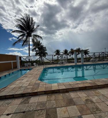 Guaibim Apartamento | Apto com piscinas e pé na areia