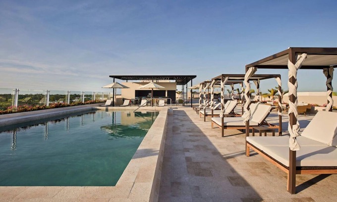 Playa del Carmen Hotel | Bask in Modern Style Comfort! 4 Spacious Units w/ Kitchenette, Free Parking
