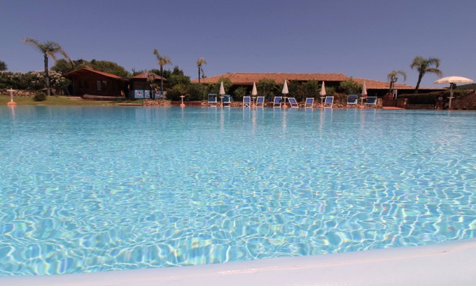 Golfo di Marinella Apartamento | PLAYA A 200 METROS Y 50 METROS PISCINA, AIRE ACONDICIONADO, PARKING.