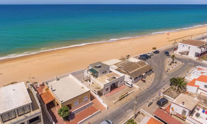 Faro Casa | Beach front right on the Sand Luxury semi-detached 3-bed house on the beach.