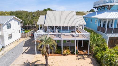 Seacrest Casa | Beach Retreat w Sundeck Golf Cart Bikes Bungalow House by AvantStay