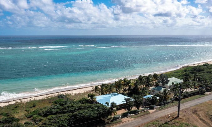 Cotton Valley Shores Villa | Beach Villa: Watch the Sunrise over the Caribbean Sea Walk right onto the Beach