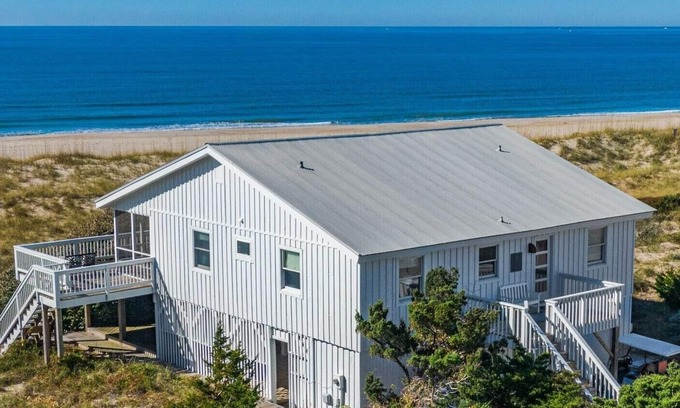 South Beach Casa | Beachfront Oasis a Classic Carolina cottage Striking Ocean Views Pet Friendly