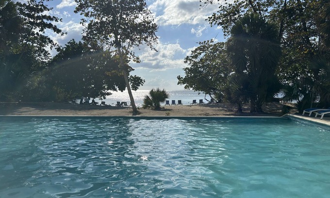 Orange Bay Villa | Beachhouse Villa located on a small bluff on a private beach. Ideal for families