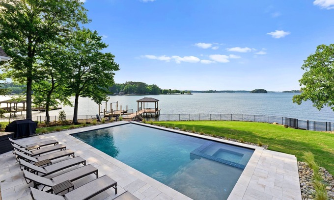 Denver Casa | Beautiful 5 Bedroom Lake-Front Home with Heated Saltwater Pool, Spa, and Dock