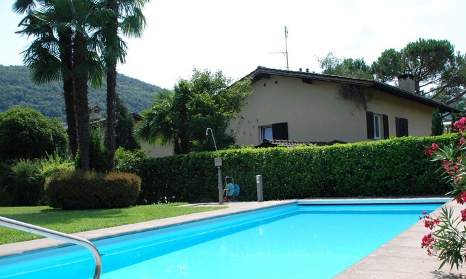 Caslano Apartamento | Hermoso apartamento para 4 personas con WIFI, piscina, TV, balcón, vista panorámica y aparcamiento