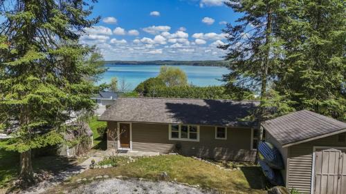 Rapid City Casa | Beautiful Torch Lake House with Beach Access home