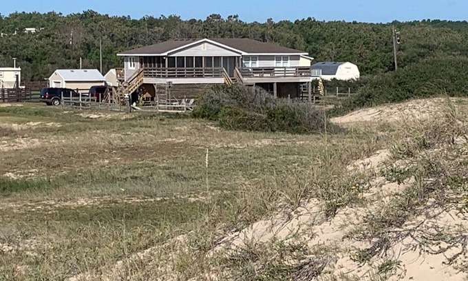 Carova Beach Casa | Book NOW! Dog friendly, partial Ocean View, 4x4 Area, Cozy Beach cottage .