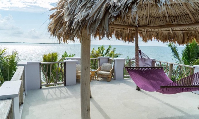 Thatch Caye Complejo | Breezy Oceanfront Cabana w/ Walk-In Shower & Private Rooftop Deck