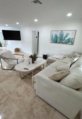 South Corals Villa | Bright Fort Lauderdale Villa with Private Heated Pool, Modern Décor and Palm-Lined Outdoor Oasis