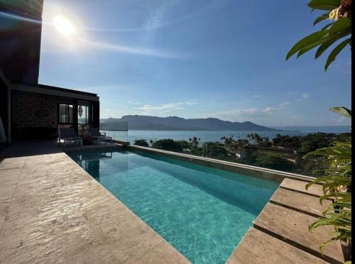 Itaguassu Casa | Casa com piscina aquecida, jacuzzi e 60 m da praia