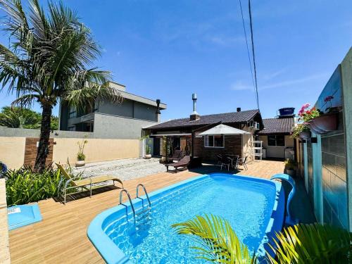 Ze Amandio Casa | CASA GOLFINHO 348 - casa aconchegante com piscina, churrasqueira, mesa de sinuca e jogos