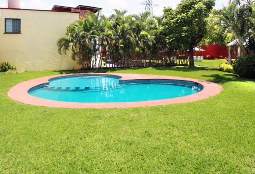 Tezoyuca Casa | Casa Palmera con Aire acondicionado Alberca Wifi cocina y TV