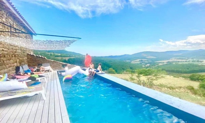 Vaudevant Otro | Modern stone farmhouse for groups has Swedish bath infinity pool billiard view