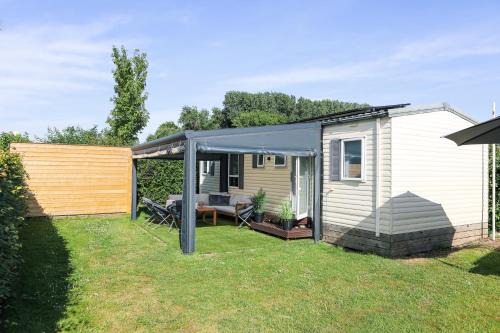 Kortgene Chalet De Esquí | Chalet met overkapping op camping aan het Veerse Meer