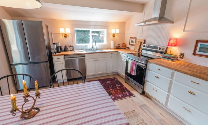 Seaside Cabaña | Charming and cozy coastal escape steps from the beach. Pet friendly!