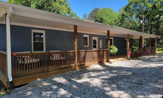 Chester Casa | Charming brick home set in the woods on 45 acres with pond and trails.