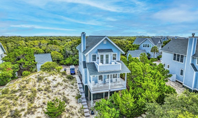 Flora's Bluff Casa | Charming cottage nestled high on the dune ridge w/both clubs!