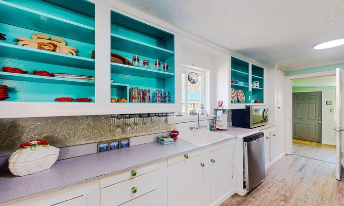 Winchester Bay Casa | Coastal home with an enclosed yard, hot tub, grill, fireplace, and W/D - dogs ok