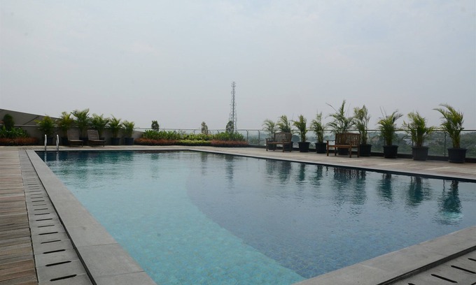 Cikokol Apartamento | Comfy and Tidy 1BR Apartment at Tree Park City BSD