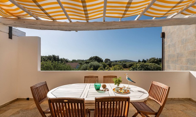 Chia Casa | Acogedor apartamento vacacional "Villa Fico 2" con balcón, jardín y aire acondicionado.