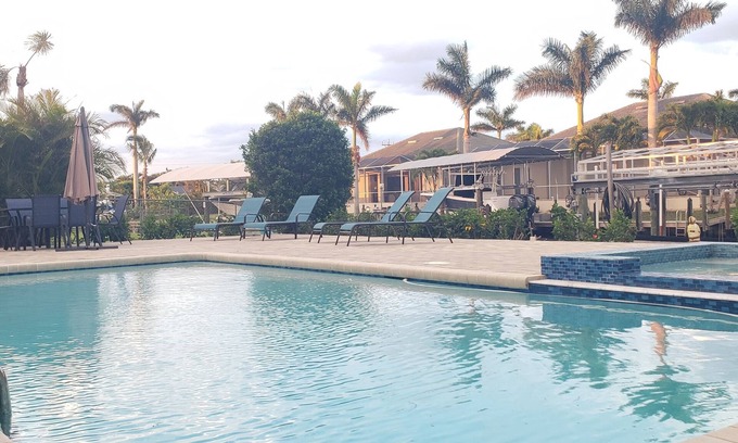 Yacht Club Casa | Cozy, bright, and spaciuos WF home with pool, dock, pool table & more.