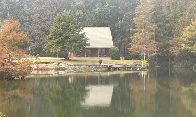 Longleaf Cabina | Cozy Cabin setting behind a 1 1/2 acre pond that is lined with Cypress Trees.