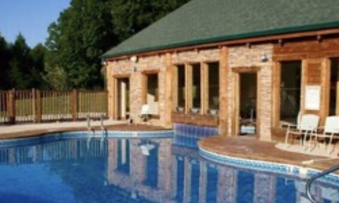 Spencer Cabina | Cozy cabin with fire pit, hot tub, and pool, and a swing set in the backyard!