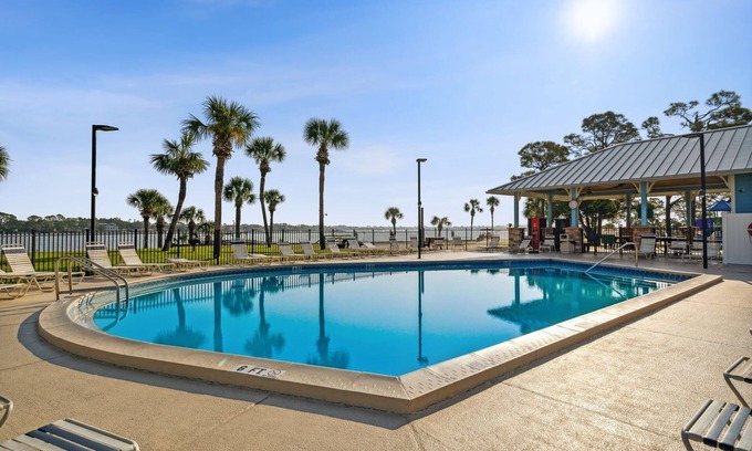 Lower Grand Lagoon Cabaña | Cozy family vacation in Panama City Beach with golf cart ,private beach, pools