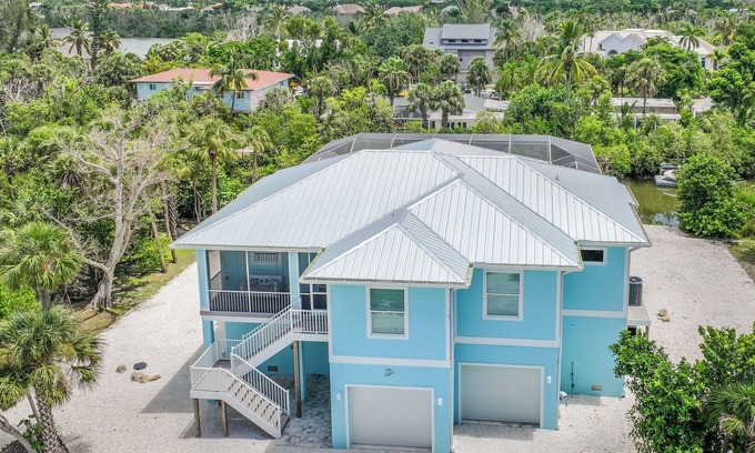 Sanibel Casa | DEJA BLUE | Lux Canal-Front Sanibel Home with Saltwater Pool and View