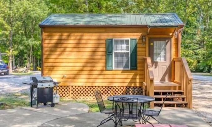 Manchester Cabina | Deluxe Cabin (w/ Bathroom) - Deluxe Cabin (w/ Bathroom) Better than a motel! Enjoy camping in comfort! Kitchen with stove top and full size fridge with dishes pots included. Full bathroom with shower. Cable TV DVD player. Gas grill on your own concre