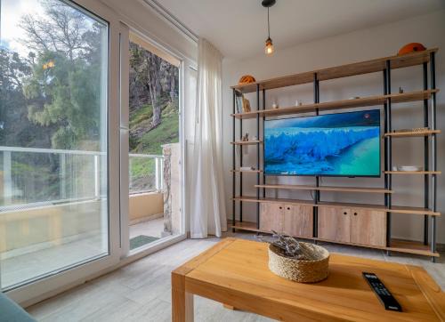 San Martin de los Andes Apartamento | Depto Nómades, con vista directa a la cascada - Ayres del Bosque Alojamientos