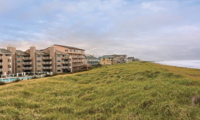 Ocean Shores Complejo | ¡Cava tus dedos en la arena y lánzate al viento!