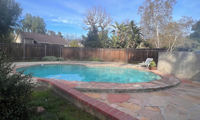 Sunland Casa | Dog friendly cottage with porch, pool, massive yard, and plenty of parking.