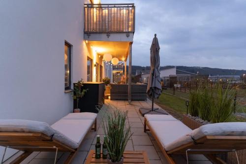 Bastad Casa | Earthy Ground Floor Home with Patio Sunbeds Greenery