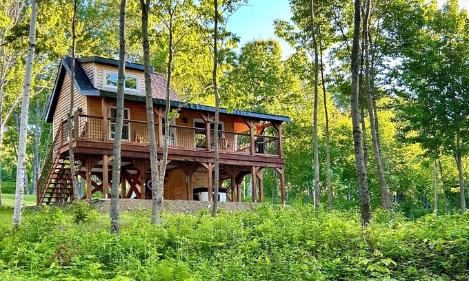 Canterbury Cabina | Elevated cabin nestled among the trees, and the Saint John River. Pet friendly.