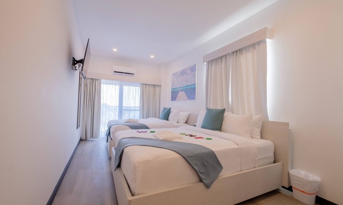 San Pedro Hotel | Enjoy gorgeous views of the island through a private balcony!