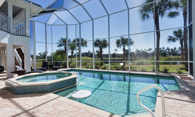 Beachview Country Club Estates Casa | Exquisite river-view home with heated pool and spa in the expansive lanai