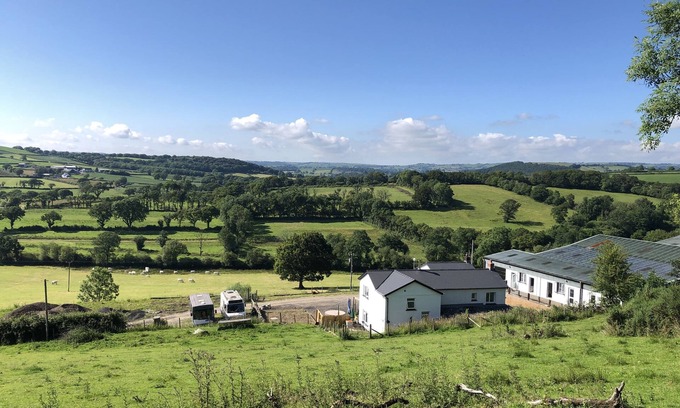 Carmarthen Cama Y Desayuno | Farm setting with large living areas and wood fired hot tub