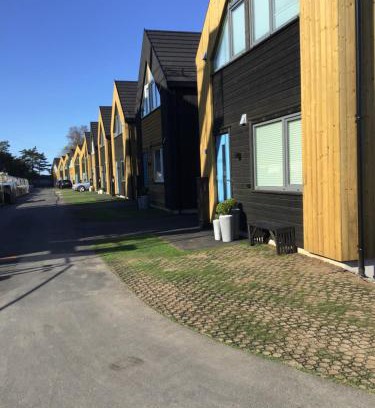 Ny Hellesund Casa | Feriehus i Søgne Sørlandet tilgang til basseng boblebad badstu