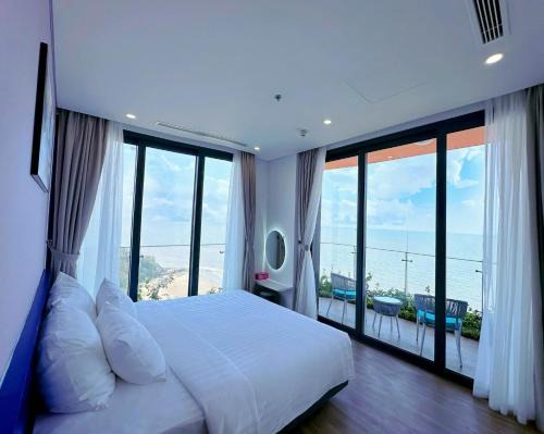 Hoang Hoa Apartamento | Flamingo Hải Tiến, Deluxe Room Sea View, 2 phòng, ban công rộng và có bồn tắm massage