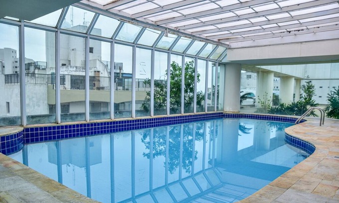 Morro do Maluf Apartamento | Flat c varanda na Praia de Pitangueiras-Guarujá/SP