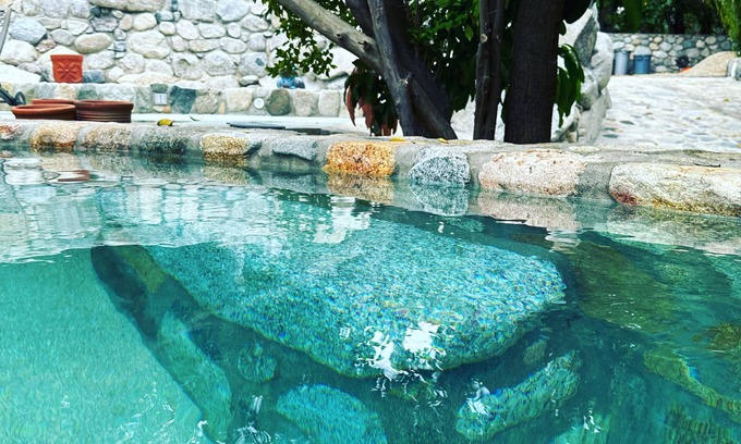 San Bartolo Villa | Glamping orchard and suites with large stone kitchen and pool in Baja Sur.