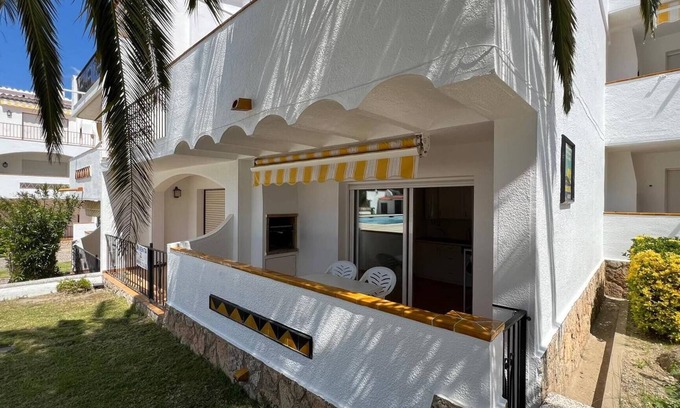 Almadraba-Canyelles Apartamento | Piso planta baja salida piscina AV-03