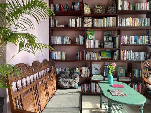 Can Tho Casa | Here Library - A wooden home by the river with a library
