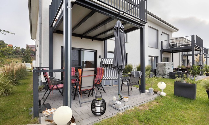 Muldestausee Apartamento | Apartamento vacacional "20b Am Goitzsche See" con vistas al lago, terraza privada y Wi-Fi